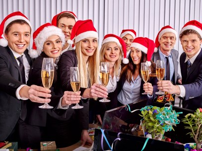 Business group people in santa hat drinking champagne  at Xmas