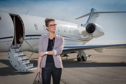 A executive business woman leaving a plane